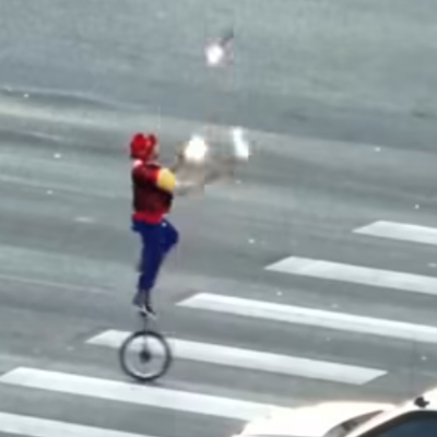 Fire-juggling unicyclist caught performing on crossing